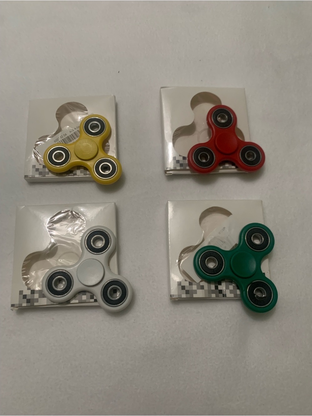 Fidget Spinner 4 Pack – Yellow, Red, White, Green